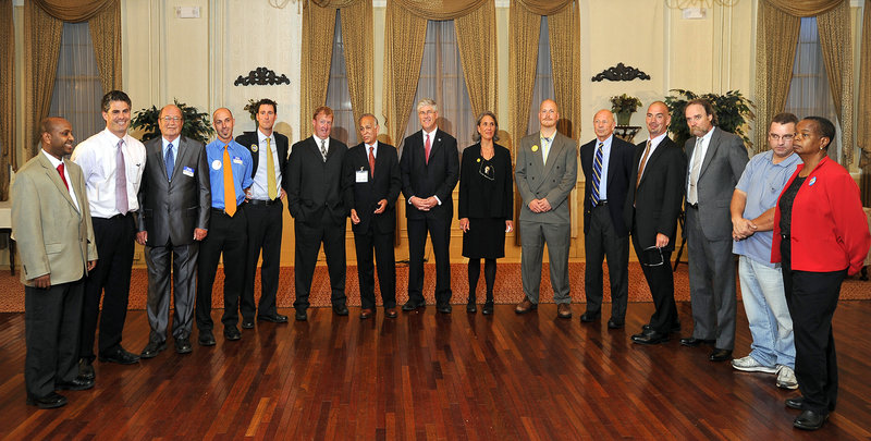 The 15 candidates wait for their chairs to arrive before they are introduced at the mayoral forum Tuesday night at the Portland Club. Each candidate gave a three-minute speech in front of the more than 100 people who attended, hoping to stand out in a crowded field. From left are Hamza Haadoow, Ethan Strimling, Peter Bryant, Marcos Miller, Jed Rathband, Christopher Vail, Ralph Carmona, Nicholas Mavodones, Jodie Lapchick, David Marshall, Michael Brennan, John Eder, Richard Dodge, Charles Bragdon and Jill Duson.