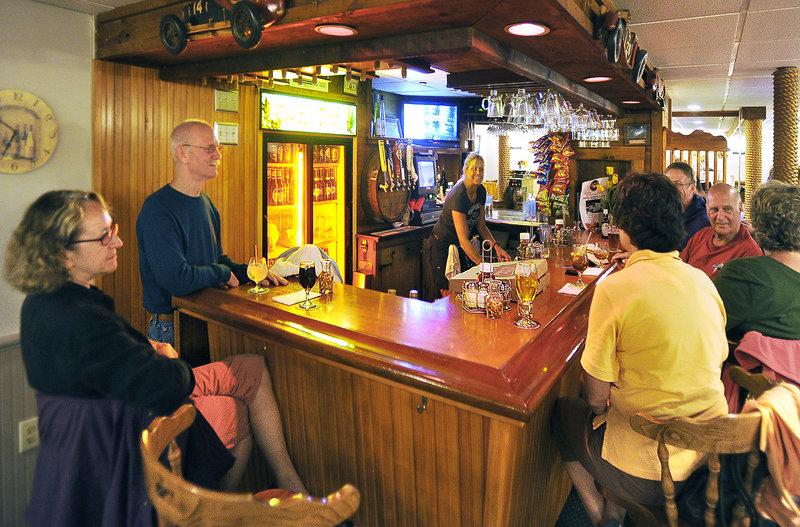 A friendly crowd of regulars enjoys the atmosphere at Pat’s Pizza in Scarborough and the repartee with bartender Toni “Tornado” MacQuinn.