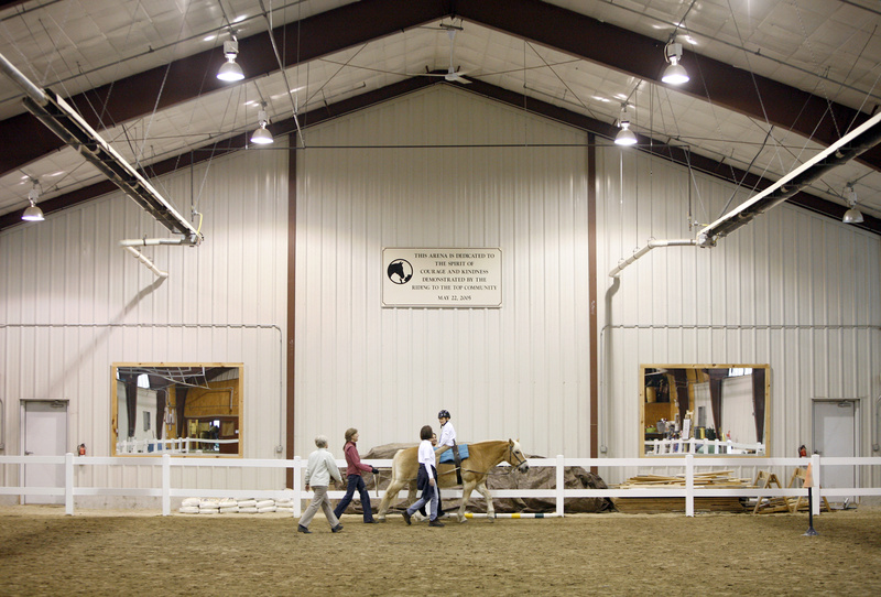 Scotty Wentzell, 10, rides backward on Luke at the Riding to the Top Therapeutic Riding Center in Windham last week. Scotty has a rare genetic disorder and could not walk until he was 7.