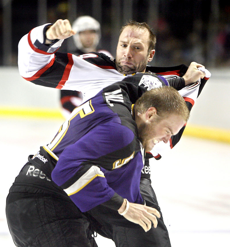 Portland's Ashton Rome throws a right at Manchester's Jordan Hill late in the second period Sunday at the Civic Center.