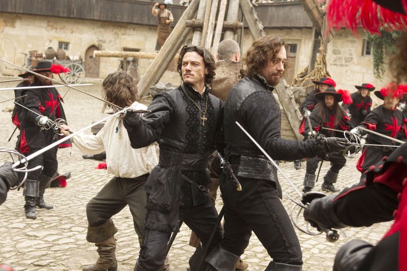 Logan Lerman (white shirt), Luke Evans, Ray Stevenson (back to camera) and Matthew Macfadyen circle the wagons in “The Three Musketeers.”