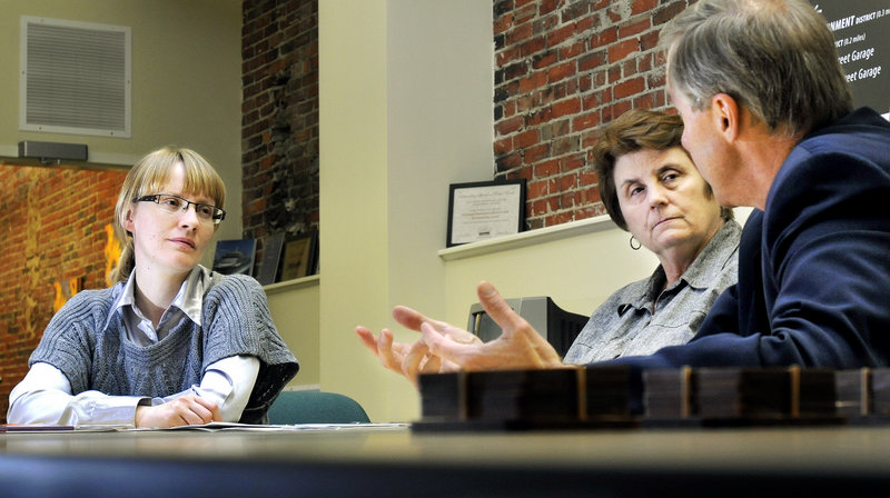 Anastasia Bogdanova, left, meets with City Councilor Ed Suslovic and Janis M. Beitzer, executive director of Portland’s Downtown District. Bogdanova liked Portland’s employee recognition programs. “Where I’m from, it’s work, work, work: no recognition,” she said.