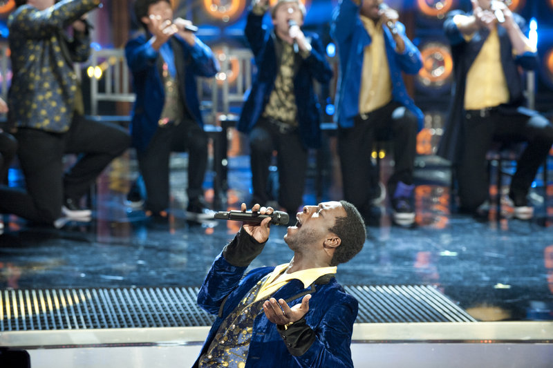 Portland’s Michael Odokara-Okigbo performs Monday night with the Dartmouth Aires on NBC’s “The Sing-Off.” They advanced to the next round of the competition.