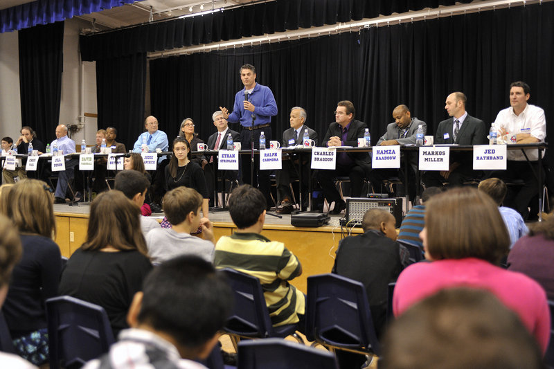 Candidate Ethan Strimling tells Lyman Moore students about his goals if he is elected mayor of Portland. One student asked Thursday how much money the mayor should make. Most candidates answered $66,000, which is the allotted salary in the city charter. But Hamza Haadoow said $50,000, Charles Bragdon said $55,000 and Peter Bryant said $100,000.