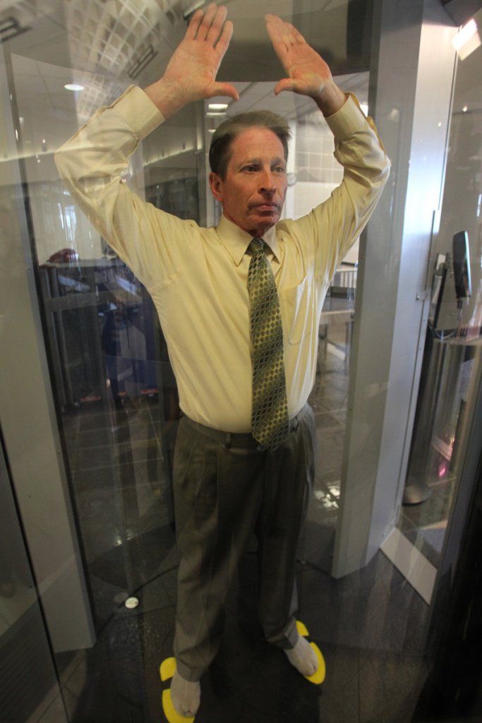 Passengers must empty their pockets before walking inside the “imaging portals,” which are a bit bigger than typical metal detectors.