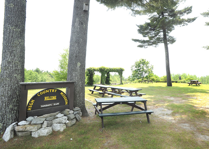 A June 9, 2011, photo of Hacker's Hill in Casco. Elsewhere on the land stand a statue of Jesus stands cradling a child and a makeshift cross formed when a lightning bolt split a 70-foot pine tree.