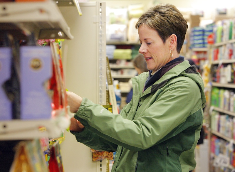 Gregory Rec/Staff Photographer: Kim Mickiewicz of South Portland shops for stocking stuffers at Reny's on Congress Street in Portland on Saturday, December 17, 2011.