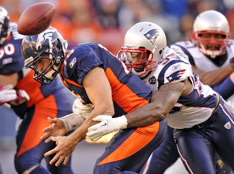 Tim Tebow fumbles in the second quarter after being hit by New England’s Mark Anderson, who also recovered the ball that led to a 1-yard TD run by Tom Brady Sunday in Denver. The Patriots won their sixth straight, 41-23.