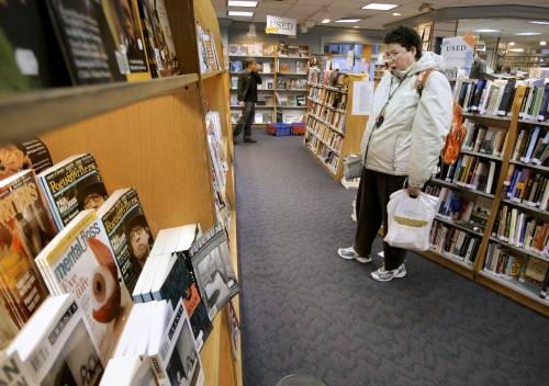 Stephanie Berry of Portland shops at Longfellow Books in Portland. The bookstore supports the city's "buy local" effort.