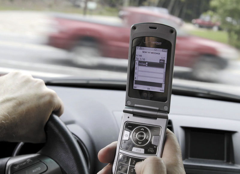 In this recent posed photo, Joseph Dea of West Hollywood, Calif., pauses as he texts while driving in in Brunswick.