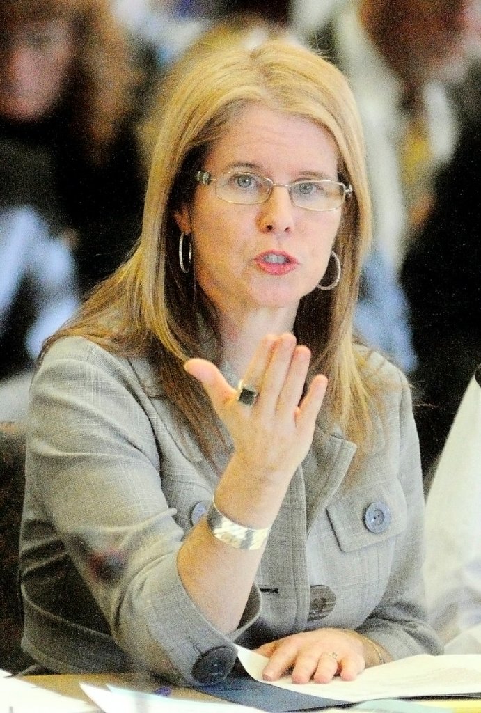 Mary Mayhew, commissioner of the Maine Department of Health and Human Services, answers questions during a meeting about a budget shortfall on Tuesday at the State House in Augusta.