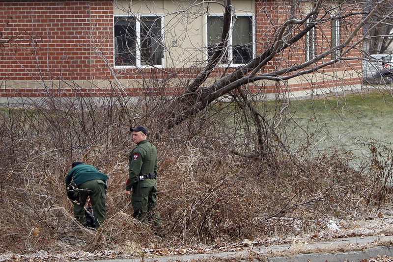 Game wardens search a field Monday for missing 20-month-old Ayla Reynolds. The Maine Warden Service, the FBI and Maine State Police are assisting Waterville police in the search.