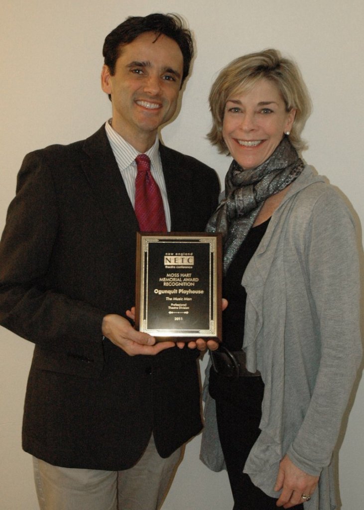 Ogunquit Playhouse executive artistic director Bradford Kenney and marketing director Cheryl Farley hold the Moss Hart Award for “The Music Man” production this summer.