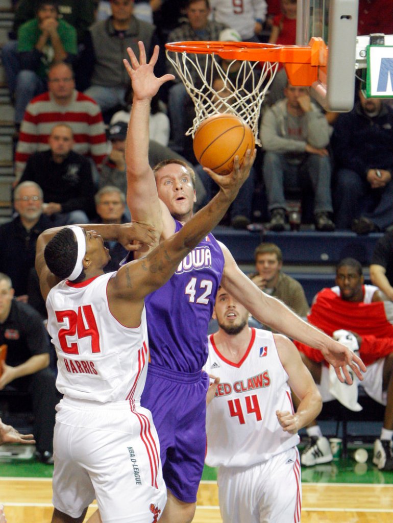 Andrew Drevo of the Iowa Energy attempts to block a shot by Paul Harris, who said of the loss: “I’m really hurt. … This is sickening.”