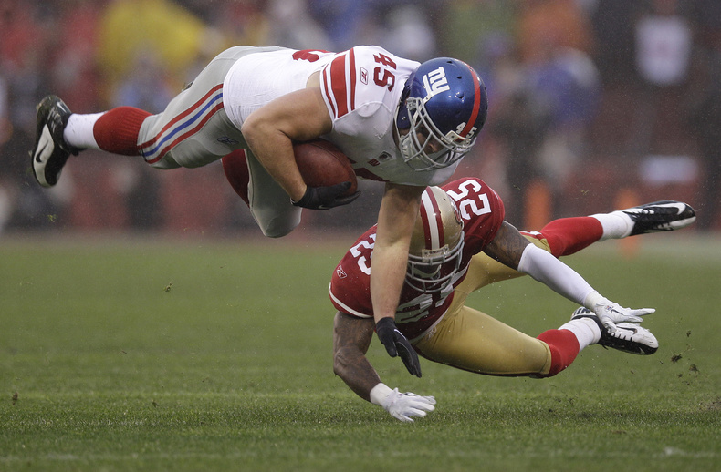 San Francisco's Tarell Brown tackles New York's Henry Hynoski during the NFC Championship game Sunday in San Francisco. playoff playoffs