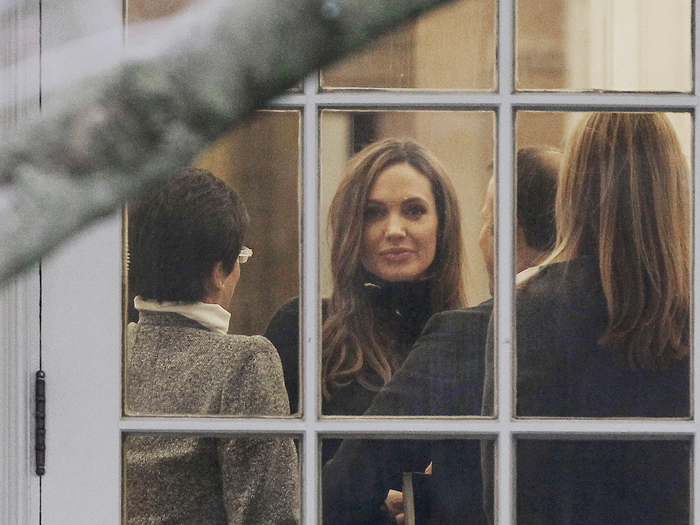 Actress Angelina Jolie is seen in the White House during a meeting with President Barack Obama.