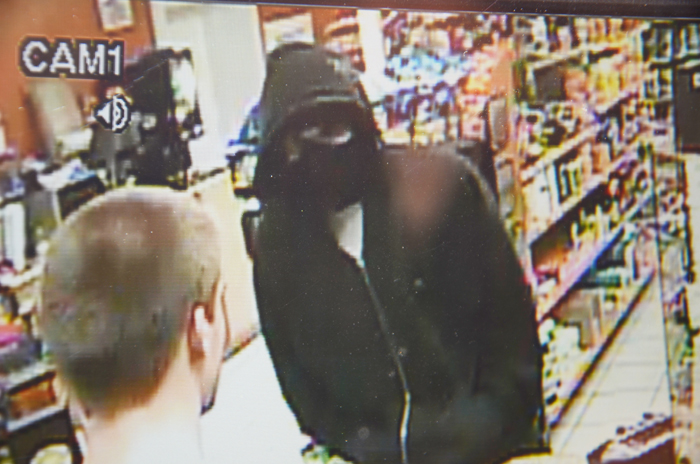 Security camera image of Global Mart robber.