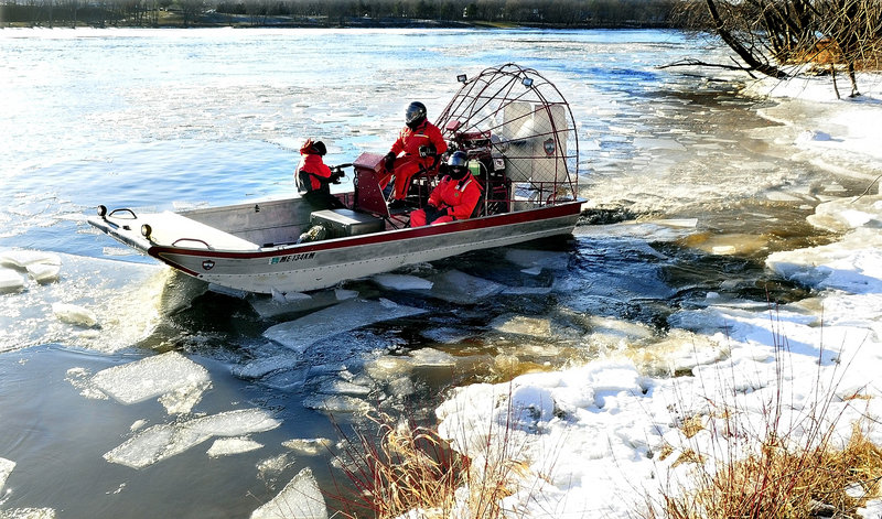 Investigators search the Kennebec River in Waterville on Wednesday.