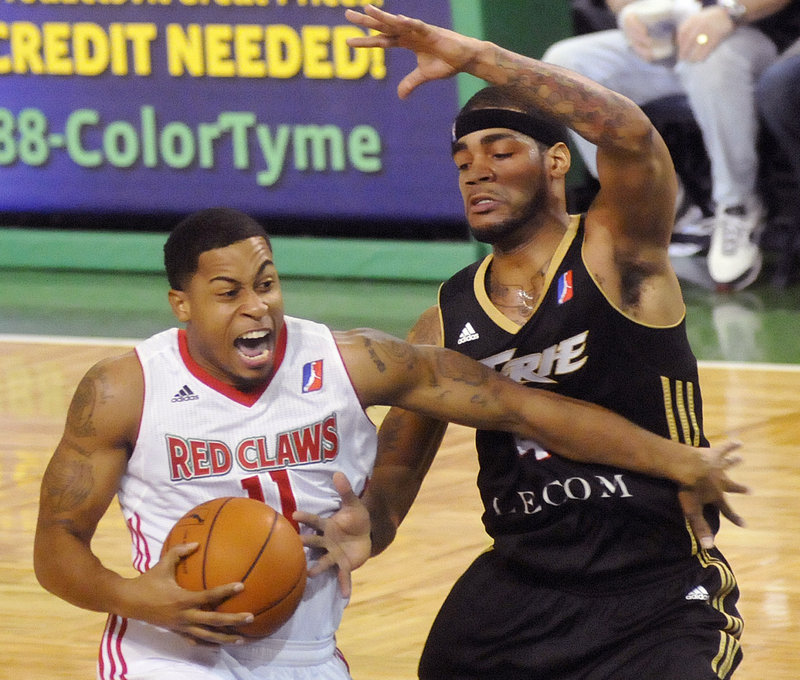 Courtney Pigram of the Maine Red Claws drives past Erie’s D.J. Kennedy in Sunday’s game at the Portland Expo. The Claws won 110-88 after losing to Erie by nine points Friday night.