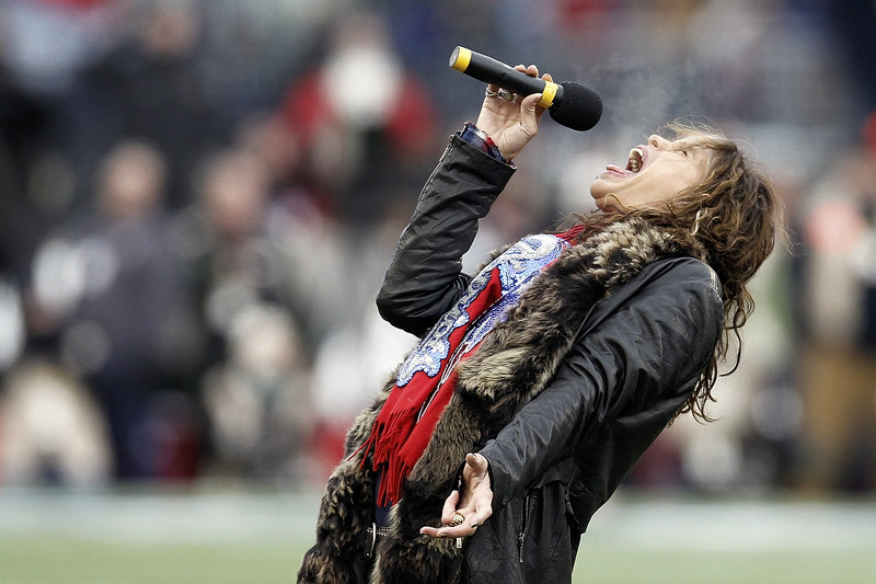 Aerosmith singer Steven Tyler sings the national anthem before the AFC Championship NFL game between the Baltimore Ravens and the New England Patriots Sunday in Foxborough, Mass.