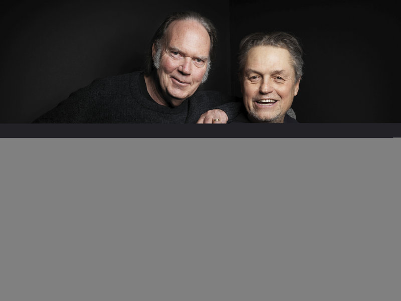 Neil Young, left, and director Jonathan Demme talk about “Neil Young Journeys” on Saturday at the Slamdance Film Festival in Park City, Utah.