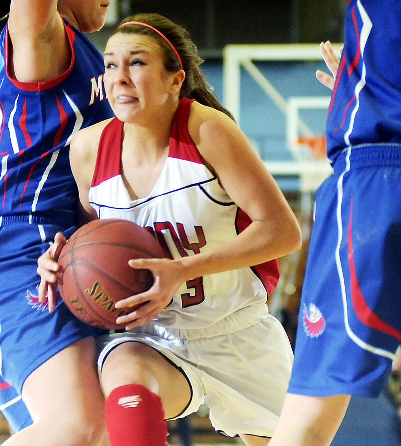 COMING THROUGH: Cony High School’s Josie Lee runs between Mt. Ararat High School’s defenders during an Eastern Maine Class A semifinal game Wednesday in Augusta.