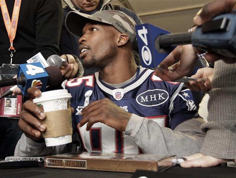 New England Patriots wide receiver Chad Ochocinco answers questions during a news conference on Wednesday, Feb. 1, 2012, in Indianapolis. (AP Photo/Mark Humphrey)