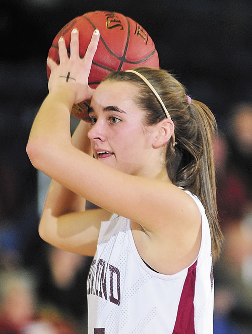 LEADING THE CHARGE: Richmond’s Jamie Plummer looks for someone to pass to during the Western Maine Class D tournament Tuesday morning at the Augusta Civic Center. Plummer leads the Bobcats in scoring and rebounding. Richmond plays Rangeley for the regional title at 1 p.m. today at the Augusta Civic Center.