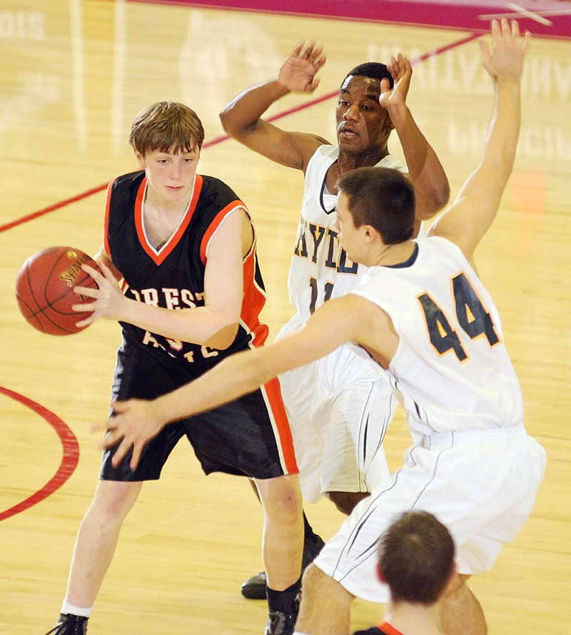 Forest Hills freshman forward Ryan Petrin is double teamed by Hyde defenders Tyquan Ekejiuba, center, and Talin Rowe.