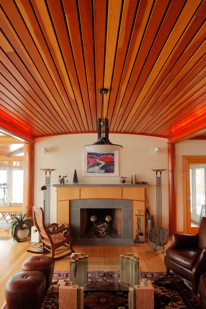 The living room features a bluestone fireplace and a ceiling of Douglas fir.