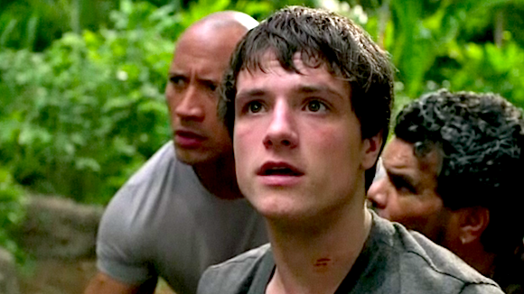 Josh Hutcherson, front, as Sean Anderson, Dwayne Robinson, left, as his stepdad, and Luis Guzman as their chopper pilot in “Journey 2: The Mysterious Island.”