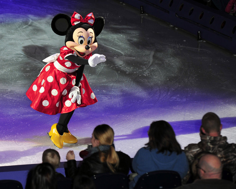 Minnie Mouse waves to the audience during “Treasured Moments,” one of many acts in the Disney on Ice show Thursday night at the Cumberland County Civic Center.