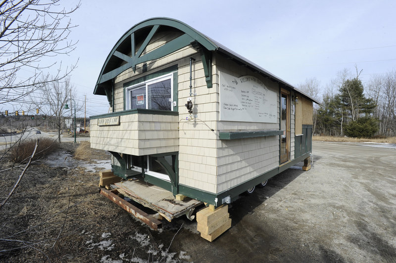The Black Ghost Cafe is for sale along Route 302 in Raymond. The cafe, which was intended to float in Sebago Lake, sank last year immediately upon being launched.