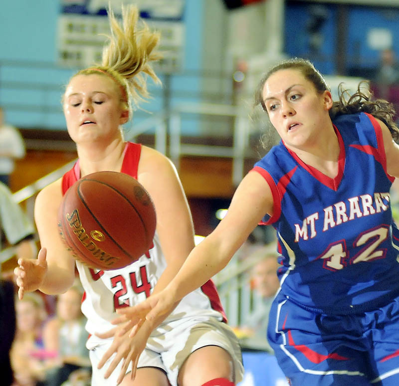 Mallory Nelson of Mt. Ararat knocks the ball away from Emily Sanford of Cony during their Eastern Class A semifinal at Augusta. Top-seeded Cony advanced with a 46-39 victory.