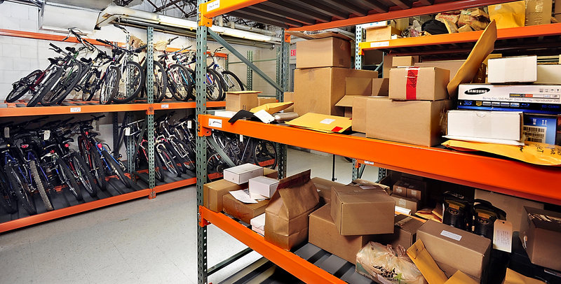 Items that were found or confiscated by Portland police fill the evidence room in the basement of the building housing the Portland Police Department, where they will be held until they are auctioned.