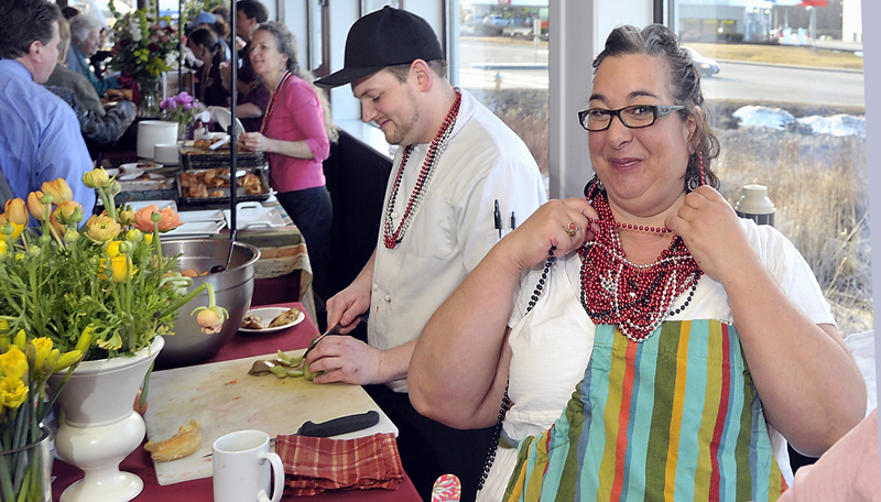 Lisa Kostopoulos, owner/executive chef at the Good Table in Cape Elizabeth, shows off her large collection of beads, the voting devices used at the Incredible Breakfast Cook-Off held at Sea Dog Brewing Co. in South Portland. She collected the most beads and beat the competition again for the third year in a row.