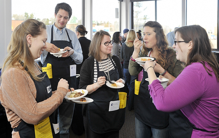 A group from Preble Street enjoys the many tasty breakfast dishes from nine different restaurants at the Incredible Breakfast Cook-Off today. Left to right are Shoshona Smith, Matt Brown, Teresa Pinney, Elise Boyson and Danna Cooper.