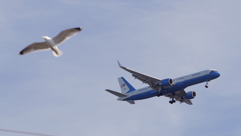 Air Force One flies over Southern Maine Community College, before he lands at the Portland International Jetport.