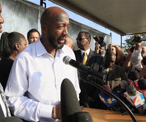 Tracy Martin, father of shooting victim Trayvon Martin, speaks to thousands gathered before a rally at Fort Mellon Park in Sanford, Fla., on Thursday.