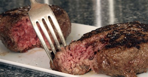 A hamburger made from ground beef containing "pink slime," or what the meat industry calls "lean, finely textured beef," right, and one made from pure 85% lean ground beef are ready for tasting.