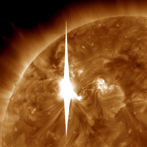 This handout image provided by NASA shows a solar flare erupting at 7 p.m. EDT on Tuesday, March 6, 2012, which was then sent hurtling toward Earth. (AP Photo/NASA)