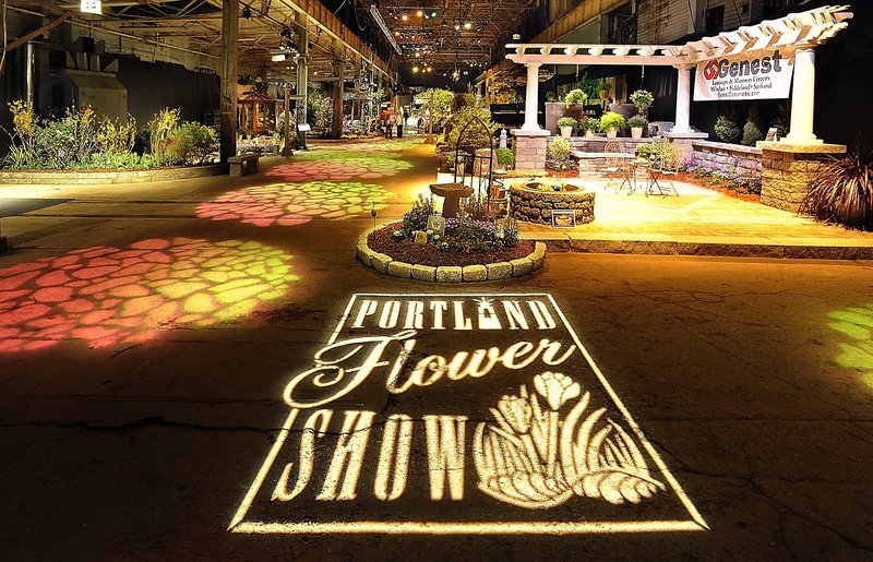 The grand entrance to the 2011 Portland Flower Show at the Portland Company Complex was enhanced by projected lighting.