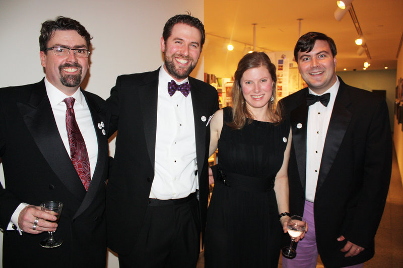 Event committee member Brett Johnson, Dan Meyer, event committee member Molly Meyer and member services director Will Cary.