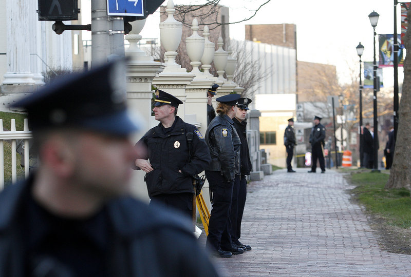 Portland police officers secure Spring Street as President Obama visits the Portland Museum of Art on Friday. Obama spoke for about 15 minutes and then took questions.