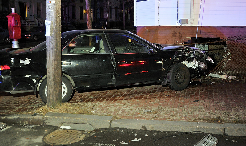 A 1997 Toyota Camry struck an apartment building at 187 Danforth St. Thursday evening. The driver, a 56-year-old woman, was treated by ambulance crews at the scene.