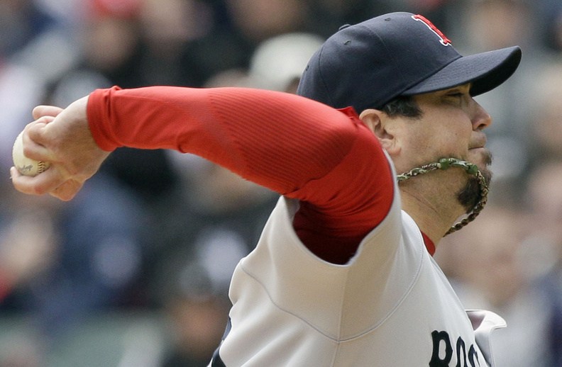 Boston Red Sox starter Josh Beckett delivers a pitch against the Chicago White Sox in Chicago on Sunday.