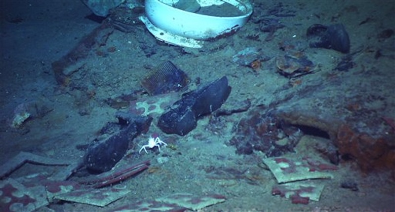 This photo provided by the Institute for Exploration, Center for Archaeological Oceanography/University of Rhode Island/NOAA Office of Ocean Exploration, shows The remains of a coat and boots, articulated in the mud on the sea bed near Titanic's stern, are suggestive evidence of where a victim of the disaster came to rest. (AP Photo/Institute for Exploration, Center for Archaeological Oceanography/University of Rhode Island/NOAA Office of Ocean Exploration)