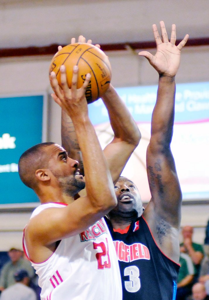 Lawrence Hill, shooting over Springfield’s Jamar Brown, was an inside force Sunday for the Red Claws, finishing with 16 points, 12 rebounds and six blocked shots.