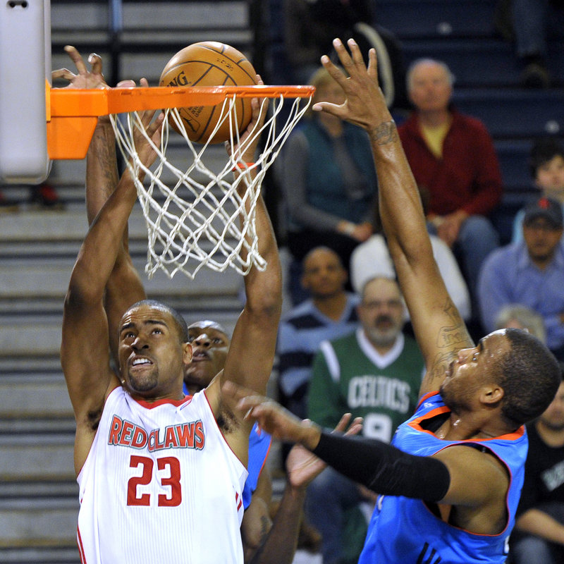 Lawrence Hill of the Maine Red Claws finds room between two Tulsa defenders to pull down a rebound Saturday night in the first half of Maine’s 84-82 victory.