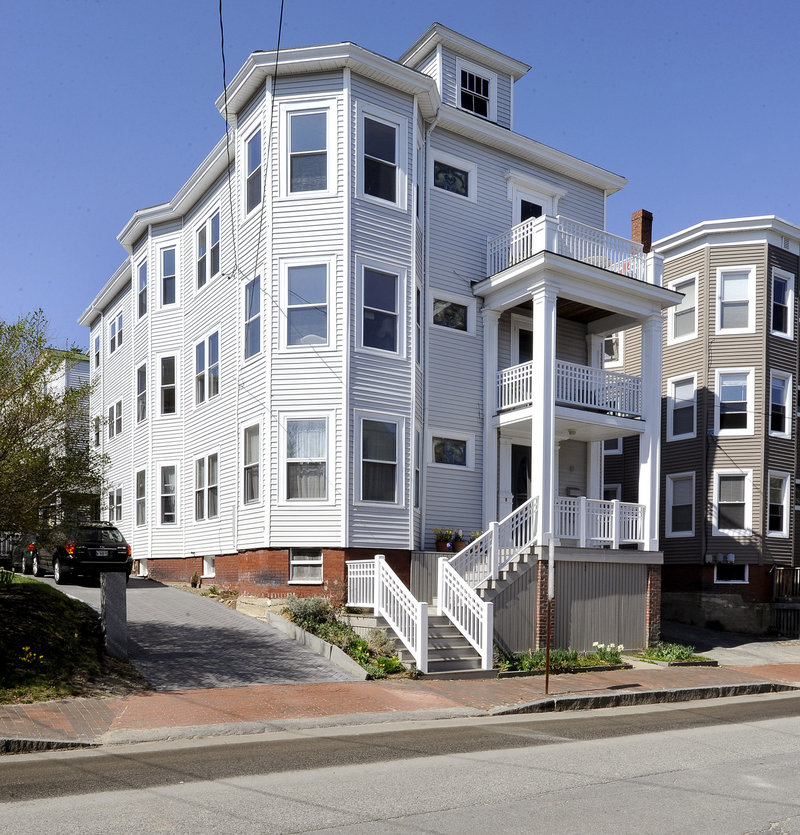 A close-up of the Hawkes-Teas home, which retains some Colonial Revival elements. The owners live on the third floor and rent the remaining space.